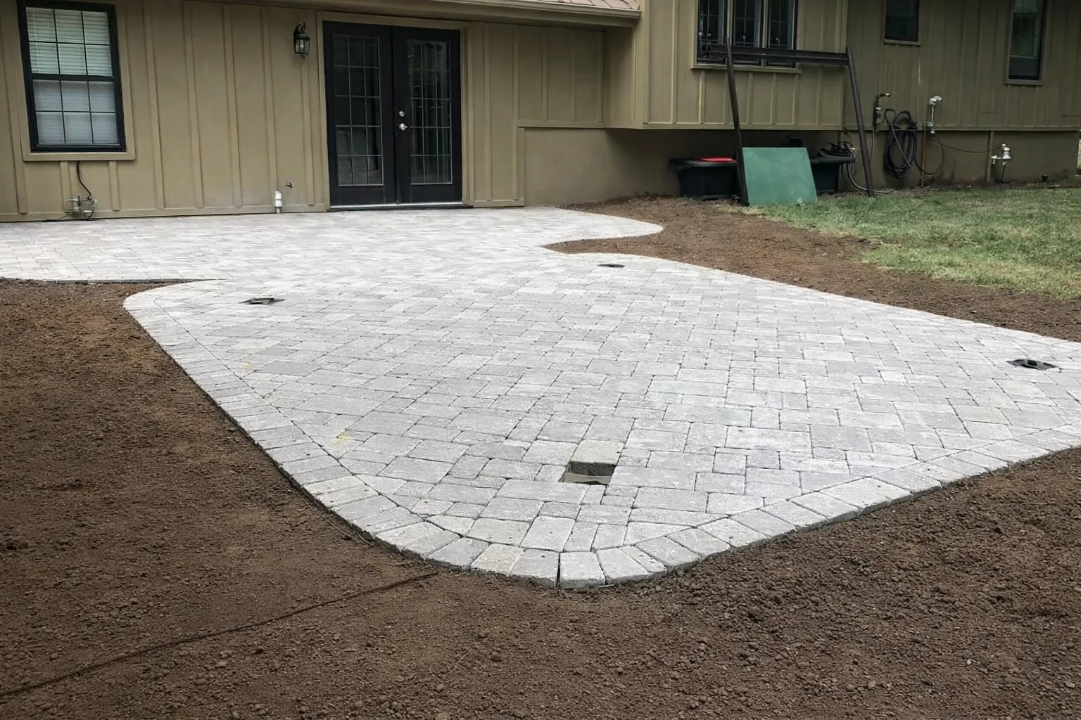Paver patio hardscaping project completed in Overland Park by Volz Lawn & Landscape