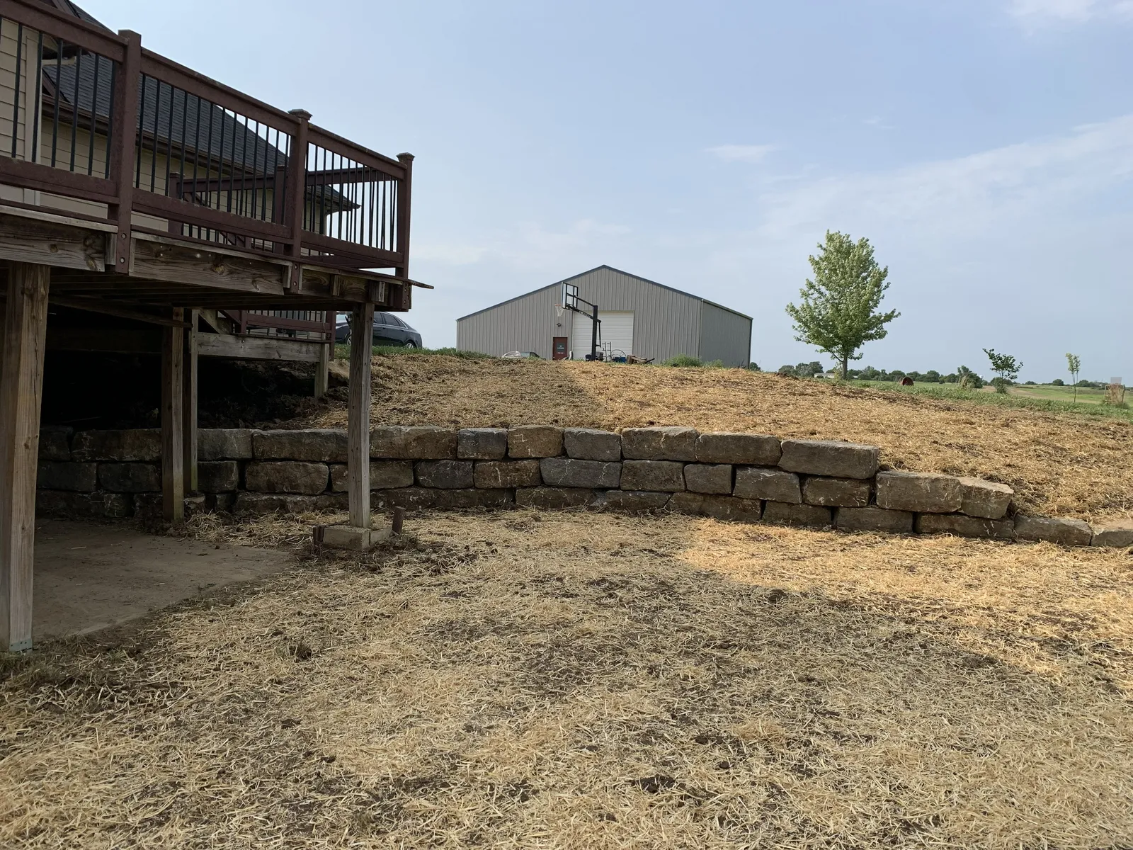 Limestone retaining wall project completed in Olathe by Volz Lawn & Landscape