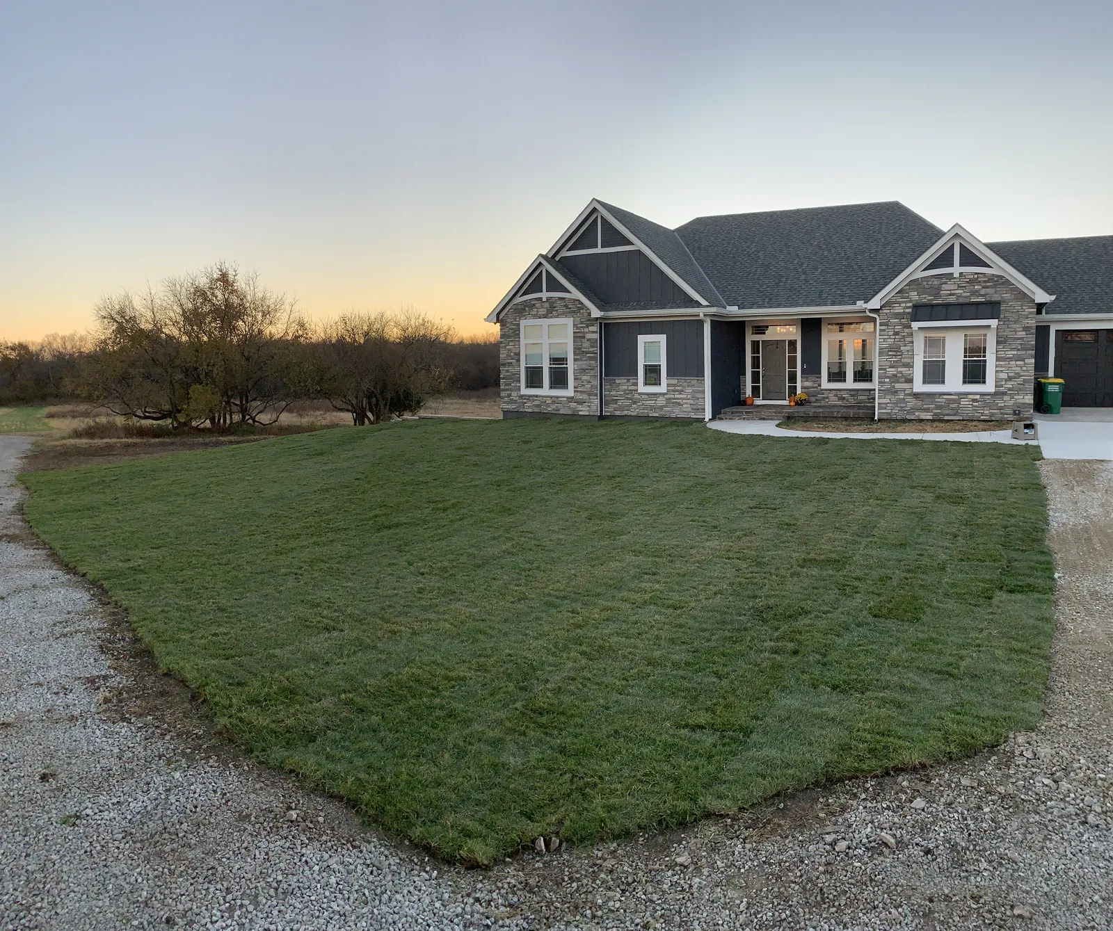 Restored sod lawn in a Spring Hill, KS subdivision by Volz Lawn & Landscape